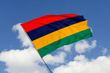 Mauritius flag isolated on the blue sky background. close up waving flag of Mauritius. flag symbols of Mauritius. Concept of Mauritius.