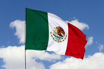 Mexico flag isolated on the blue sky background. close up waving flag of Mexico. flag symbols of Mexico. Concept of Mexico.