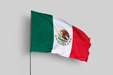 Mexico flag isolated on the blue sky background. close up waving flag of Mexico. flag symbols of Mexico. Concept of Mexico.
