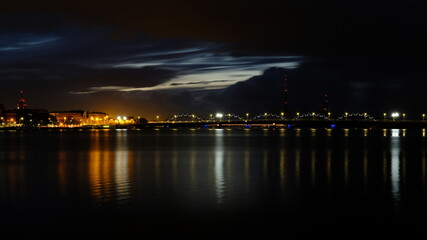 Autumn sunrise in Riga reflection of night lights in the Daugava