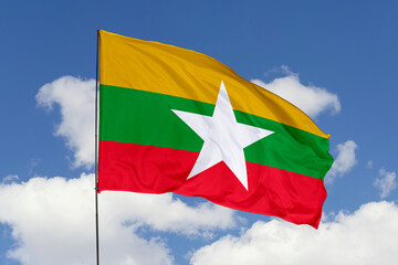 Fototapeta na wymiar Myanmar flag isolated on the blue sky background. close up waving flag of Myanmar. flag symbols of Myanmar. Concept of Myanmar.