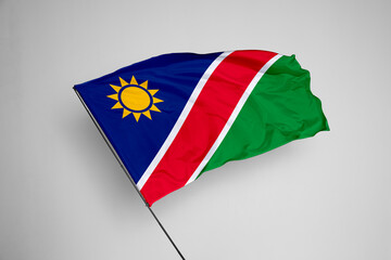 Namibia flag isolated on white background. close up waving flag of Namibia. flag symbols of Namibia. Concept of Namibia.