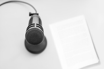 Professional microphone and blank sheet of paper