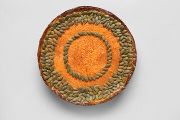 Delicious pumpkin pie on light background