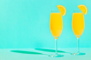 Refreshing orange Mimosa cocktails with champagne.
