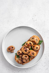 Halloween spooky pizza bread with skull-shaped mushrooms. Halloween lunch food