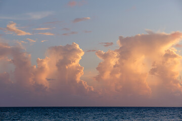 Naklejka na ściany i meble Beautiful colored cloudy evening sky. Seascape.