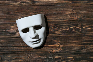 Guy Fawkes mask on wooden background