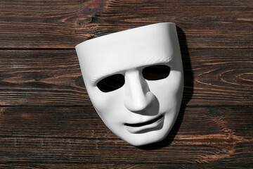 Guy Fawkes mask on wooden background