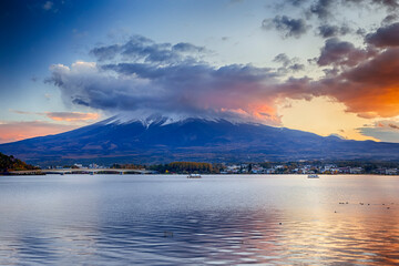 Asian Destinations. Picturesque Kawaguchiko Lake in Front of Japanese Fuji Mountain with Long Bridge and Fishing Boats in Foreground in Japan.