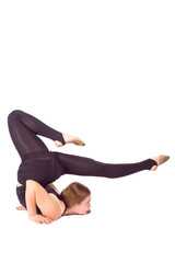 SportConcepts. Caucasian Sportswoman Rhythmic Gymnast In Training Black Outfit Posing Indoors During Backward Legs Twist Stretching Exercises On White.