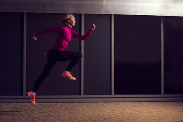 Mature Runner Having Outdoor Jogging Training Against Reflective Glass Surface Background.