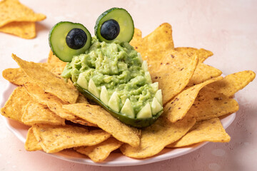 Funny alligator avocado bowl guacamole dip and nachos
