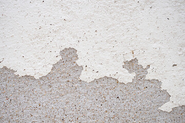 Abstract old white concrete wall with peeling paint