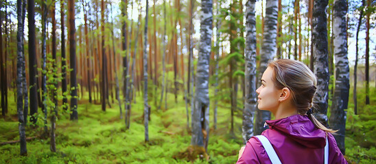 spring forest female windbreaker trekking, springtime rest nature landscape background woman tourist © kichigin19