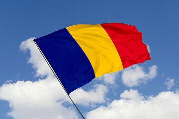 Romania flag isolated on the blue sky background. close up waving flag of Romania. flag symbols of Romania. Concept of Romania.