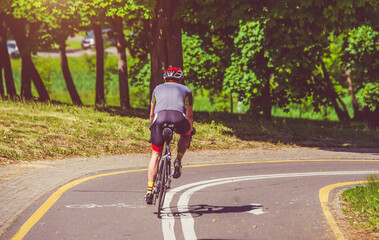 Fototapeta premium Cyclist ride on the bike path in the city Park 