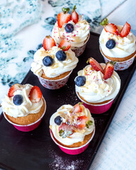 Muffins with strawberries in baking dish. top view. High quality photo