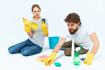 Man and woman near the sofa room cleaning provision of services