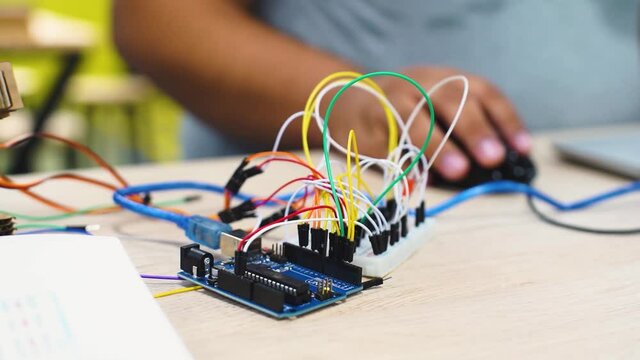 electric circuit with colored wires connected to raspberry pi to control robotics
