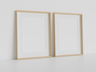 Two wooden frames leaning on white floor in interior mockup. Template of pictures framed on a wall 3D rendering