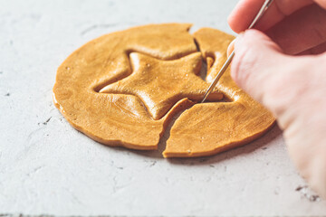 Dalgona Candy - South Korean treat. Round sugar cookie with star inside.
