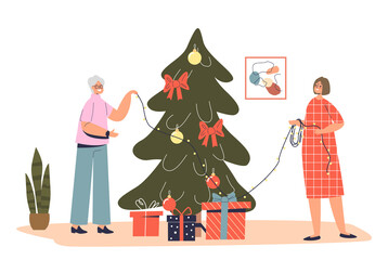 Senior lady grandmother decorating christmas tree together with granddaughter