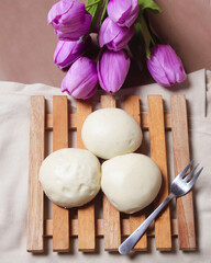 Bakpao bread for a healthy breakfast menu. It is highly recommended to eat the buns that are still hot. Bakpao usually has various fillings such as nuts and chocolate. Chinese specialties. Focus blur.