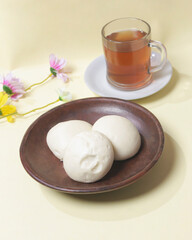 Bakpao bread for a healthy breakfast menu. It is highly recommended to eat the buns that are still hot. Bakpao usually has various fillings such as nuts and chocolate. Chinese specialties. Focus blur.