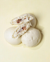 Bakpao bread for a healthy breakfast menu. It is highly recommended to eat the buns that are still hot. Bakpao usually has various fillings such as nuts and chocolate. Chinese specialties. Focus blur.