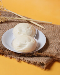 Bakpao bread for a healthy breakfast menu. It is highly recommended to eat the buns that are still hot. Bakpao usually has various fillings such as nuts and chocolate. Chinese specialties. Focus blur.