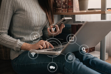 Businesswomen working with smart phone and laptop and digital tablet computer in office with digital marketing media in virtual icon.