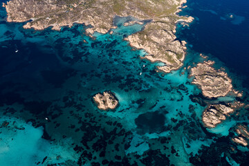 View from above, stunning aerial view of La Maddalena archipelago with some islands bathed by a turquoise and clear waters. Sardinia, Italy.