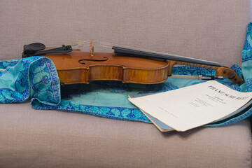 Viola - A musical string instrument with a bow, score and scarf