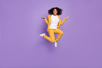 Photo of sweet charming woman dressed yellow suit spectacles compare arms empty space isolated violet color background