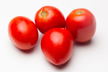 Red tomatoes on white background