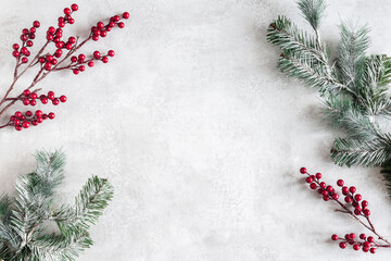 Christmas composition. Fir tree branches, red berries on gray background. Christmas, winter, new year concept. Flat lay, top view, copy space - 463562860