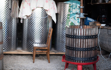 Large containers made from metal and wood and various sizes for initial processing of grapes....