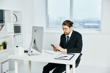 Fototapeta na wymiar businessman in a suit office work phone Lifestyle
