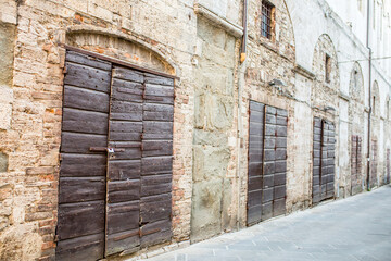 Vintage front door in the medieval city of Italy. Ancient wooden gate. Old city streets, beautiful...
