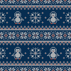 Knitted seamless pattern with penguins and scandinavian ornament. Sweater background.