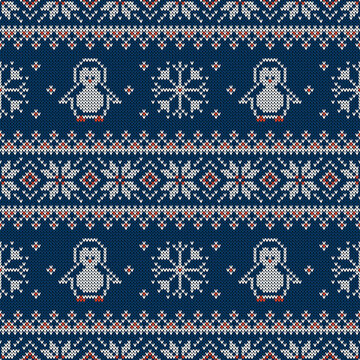 Knitted seamless pattern with penguins and scandinavian ornament. Sweater background.