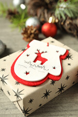 Christmas accessories on wooden table, close up