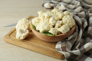 Concept of tasty food with cauliflower on wooden background - obrazy, fototapety, plakaty