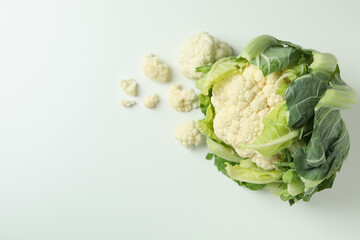 Fresh juicy cauliflower with slices on white background