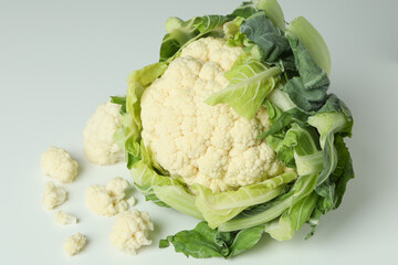 Fresh juicy cauliflower with slices on white background