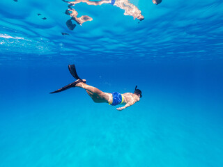 Obraz na płótnie Canvas Underwater photo freediver swim in clear sea