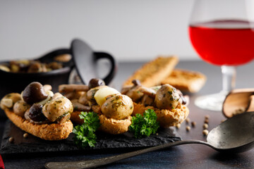 Mushrooms in garlic butter sauce. Mushrooms prepared with garlic , fresh butter and parsley served as a appetizer.