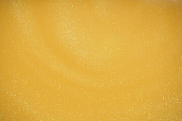 Obraz premium Golden glitter abstract background. Glamorous golden glittering magical bright festive background for New Year's party decor