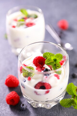 glass with yogurt and berries fruits